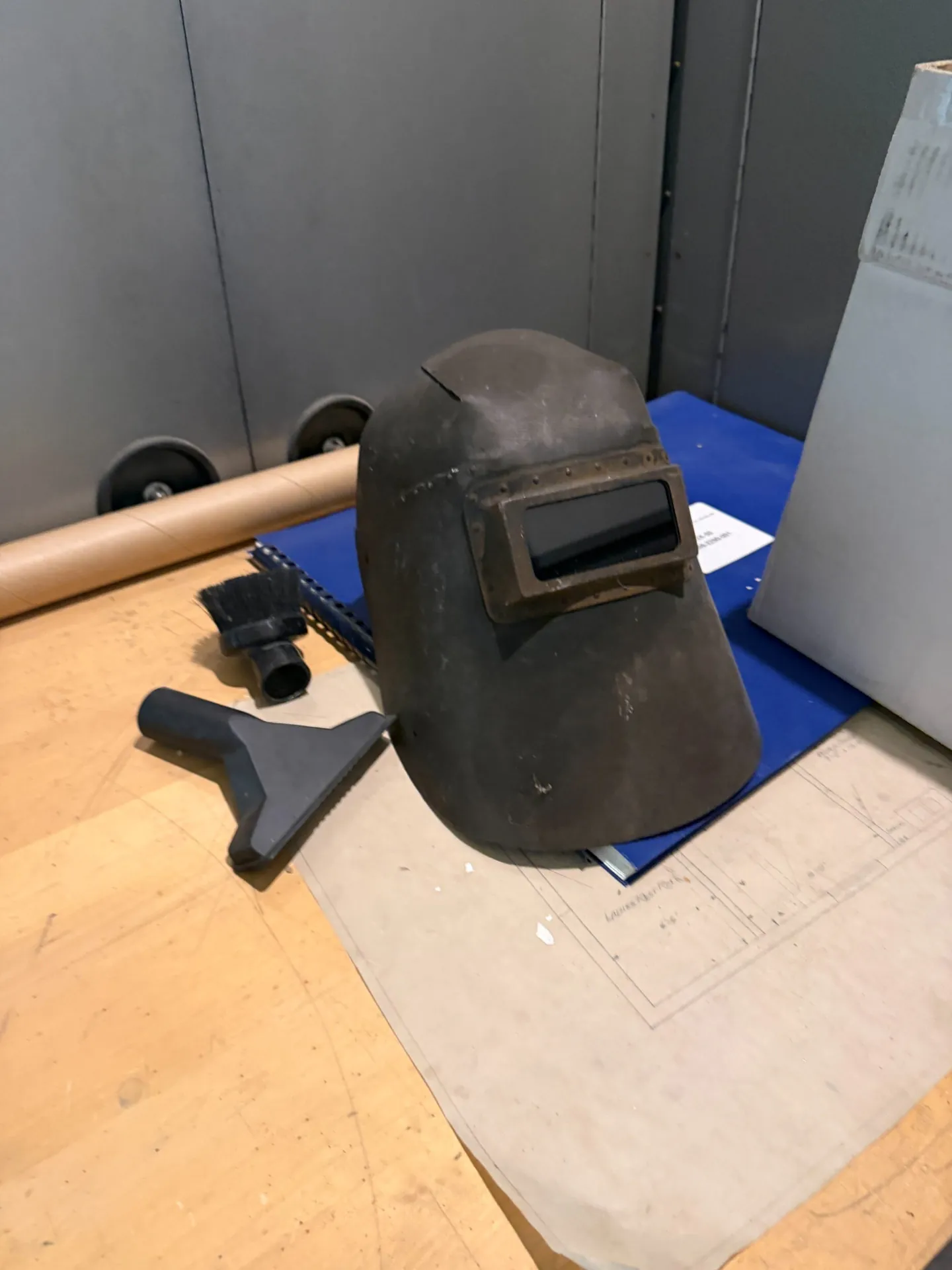 An old welding hood resting on technical papers at the WLW transmitter site